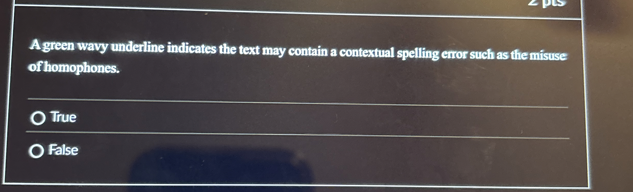 A green wavy underline indicates the text may