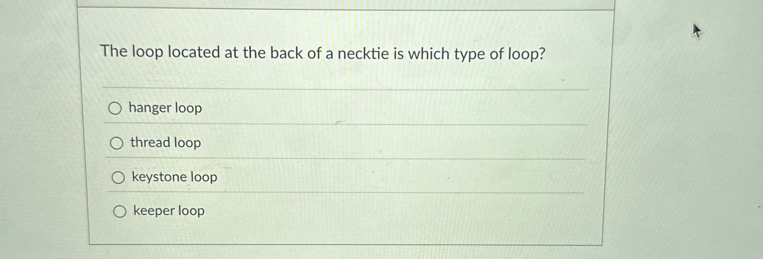 The loop located at the back of a necktie is