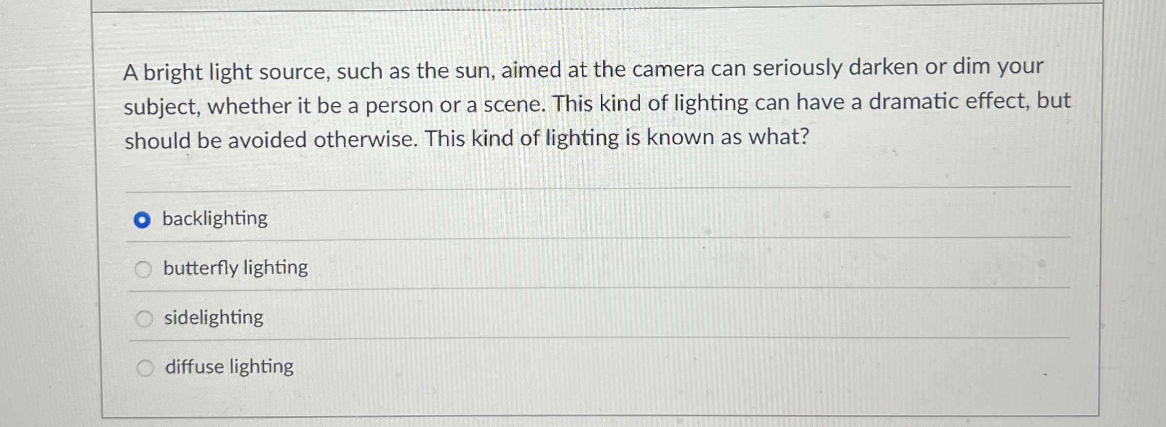 A bright light source, such as the sun, aimed at