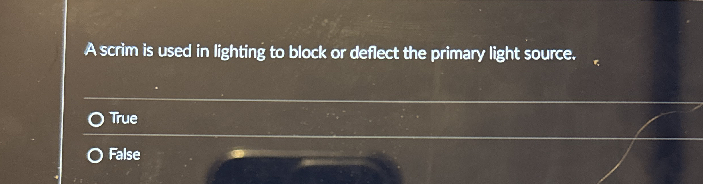 A scrim is used in lighting to block or deflect