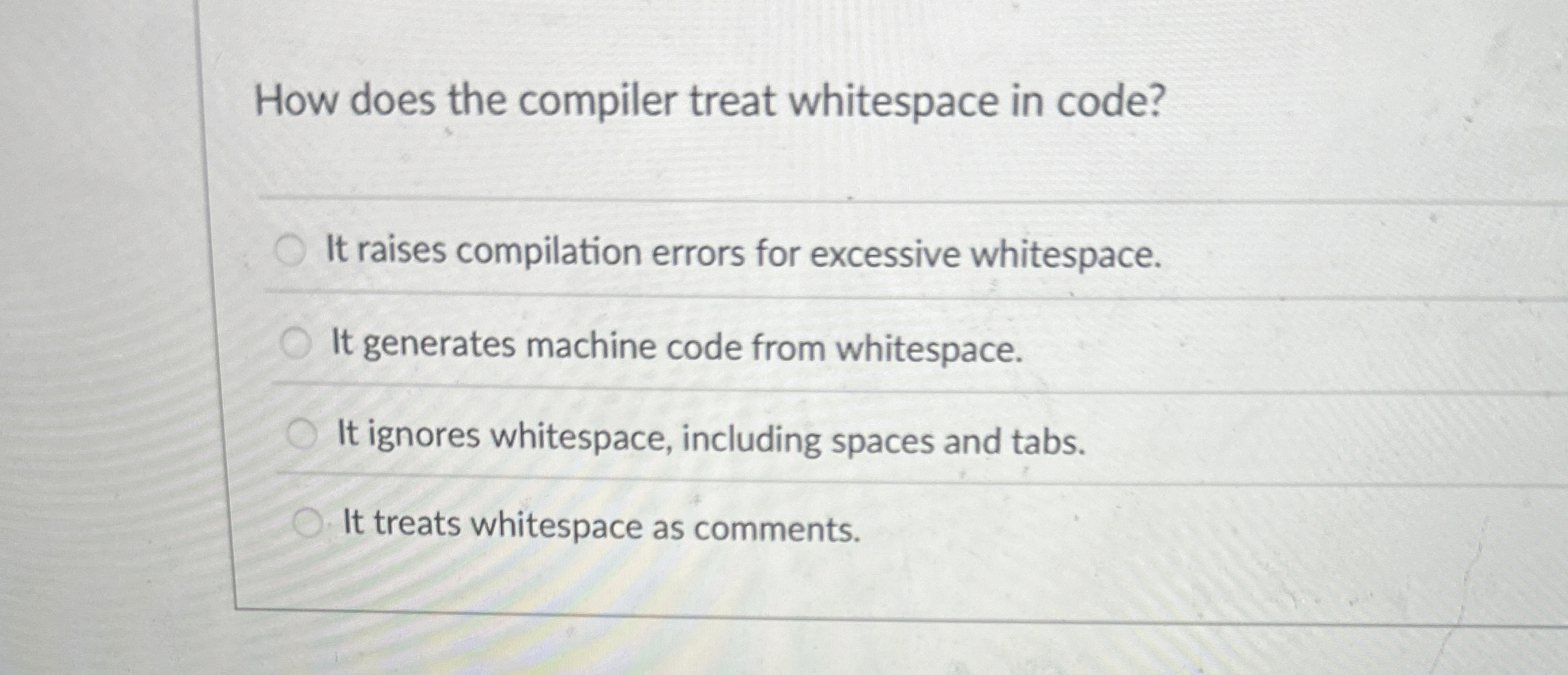 How does the compiler treat whitespace in code?