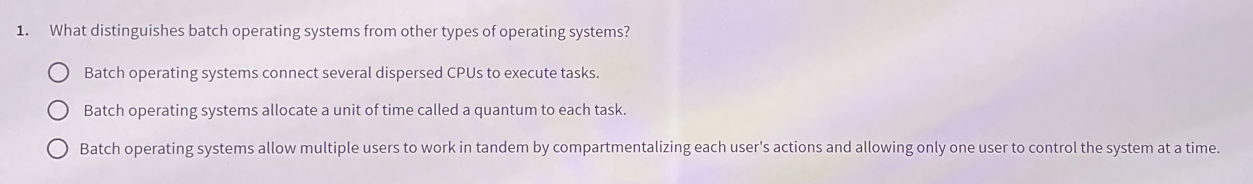 What distinguishes batch operating systems from