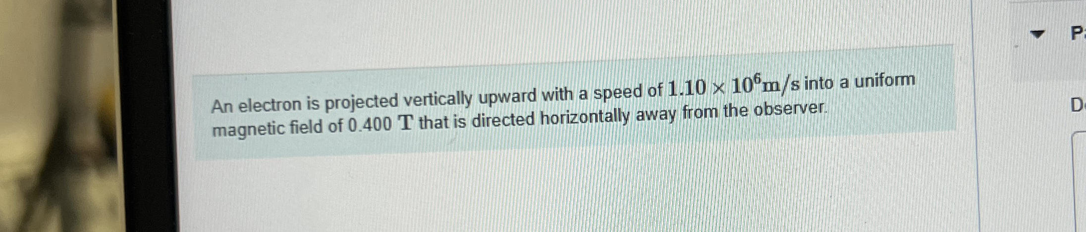 An electron is projected vertically upward with a