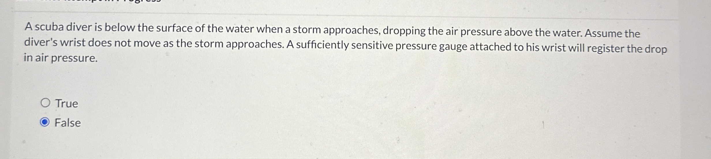 A scuba diver is below the surface of the water