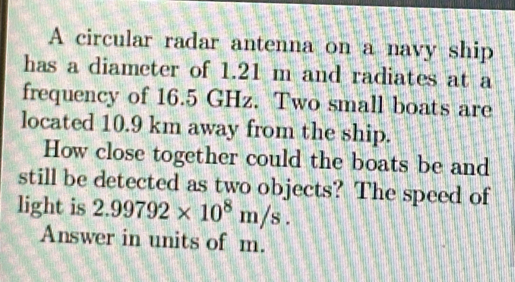 A circular radar antenna on a navy ship has a