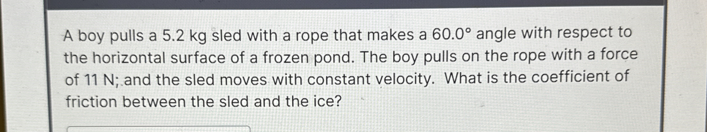 A boy pulls a 5 . 2 kg sled with a rope that
