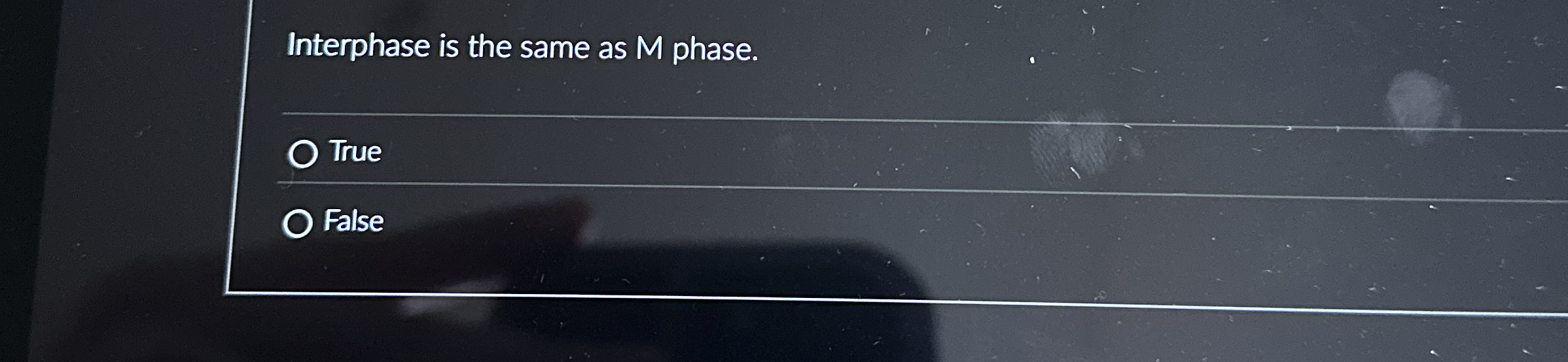 An object is suspended from a spring scale which