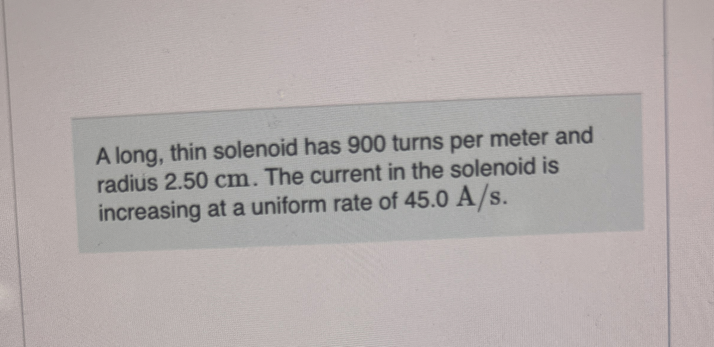 A long, thin solenoid has 9 0 0 turns per meter