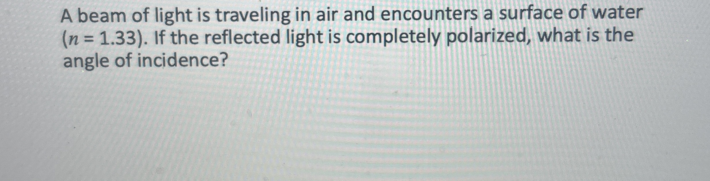 A beam of light is traveling in air and