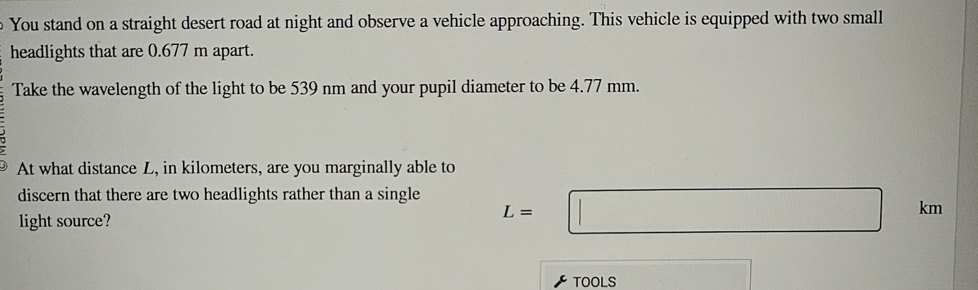 You stand on a straight desert road at night and