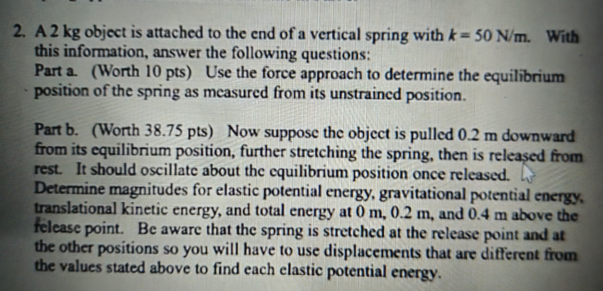 A 2 kg object is attached to the end of a