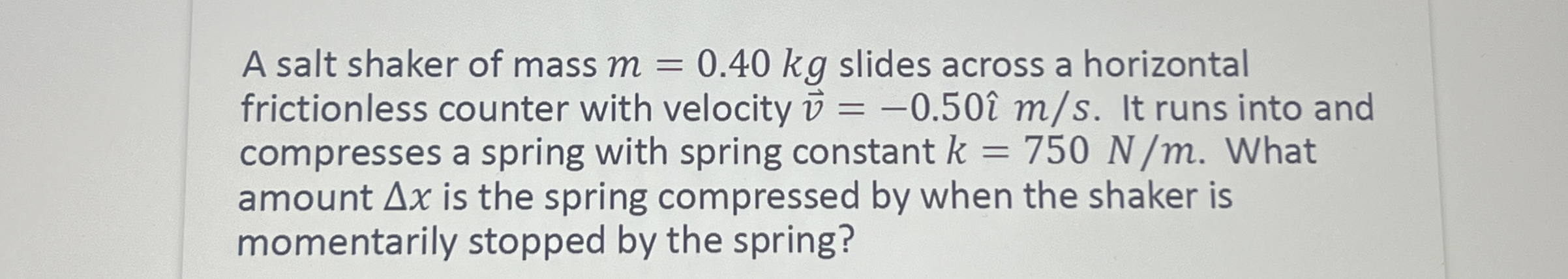 A salt shaker of mass m = 0 . 4 0 k g slides