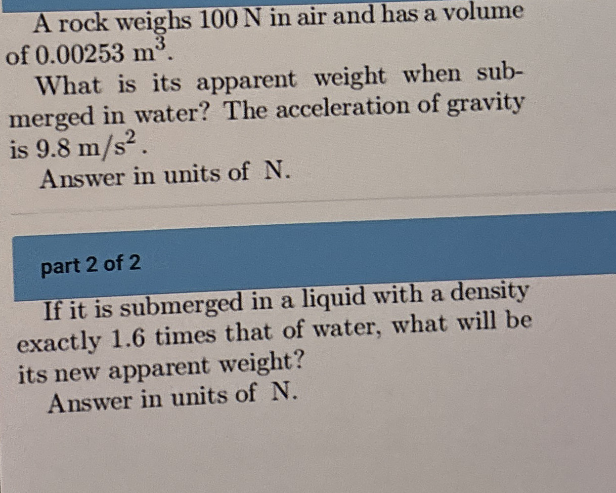 A rock weighs 1 0 0 N in air and has a volume of