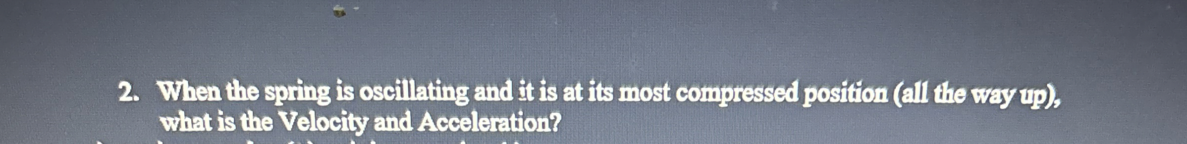 When the spring is oscillating and it is at its