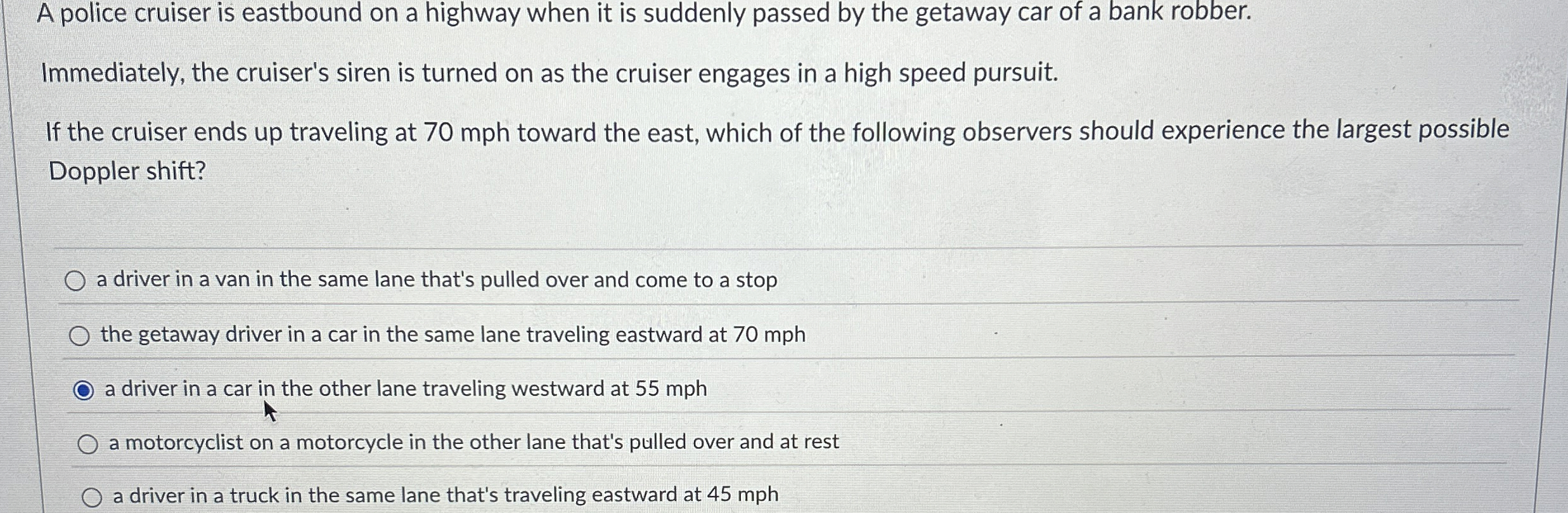 A police cruiser is eastbound on a highway when