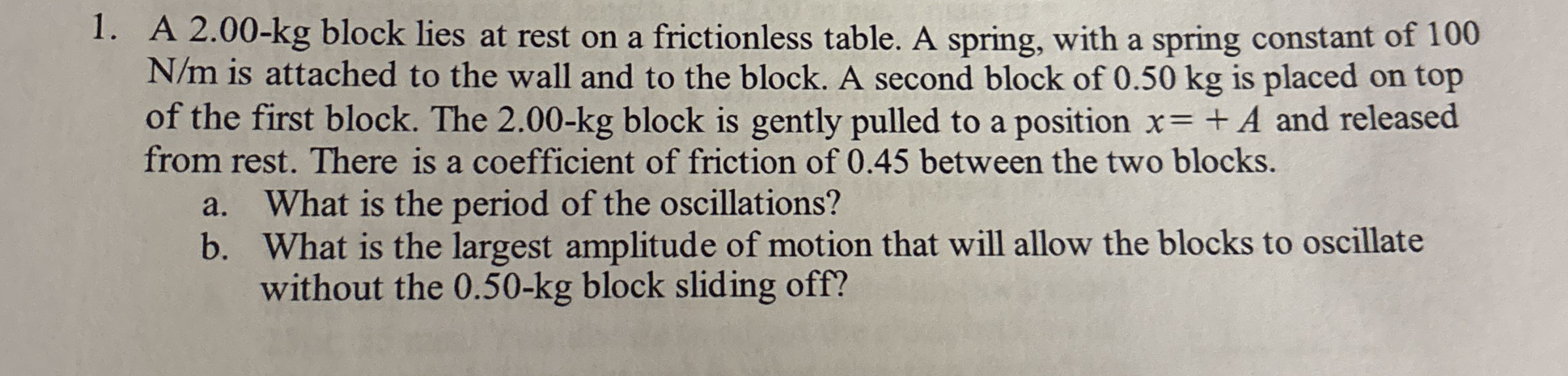 A 2 . 0 0 - k g block lies at rest on a