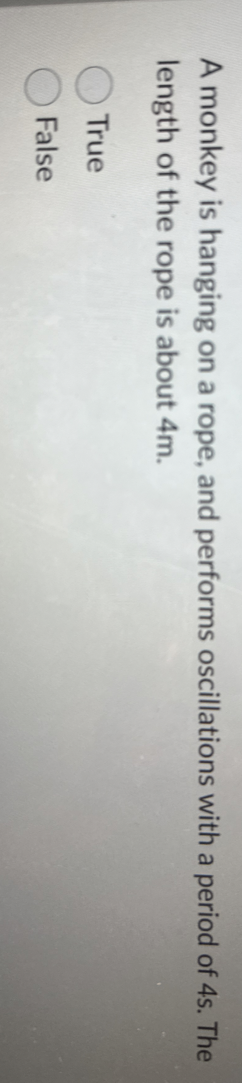 A monkey is hanging on a rope, and performs