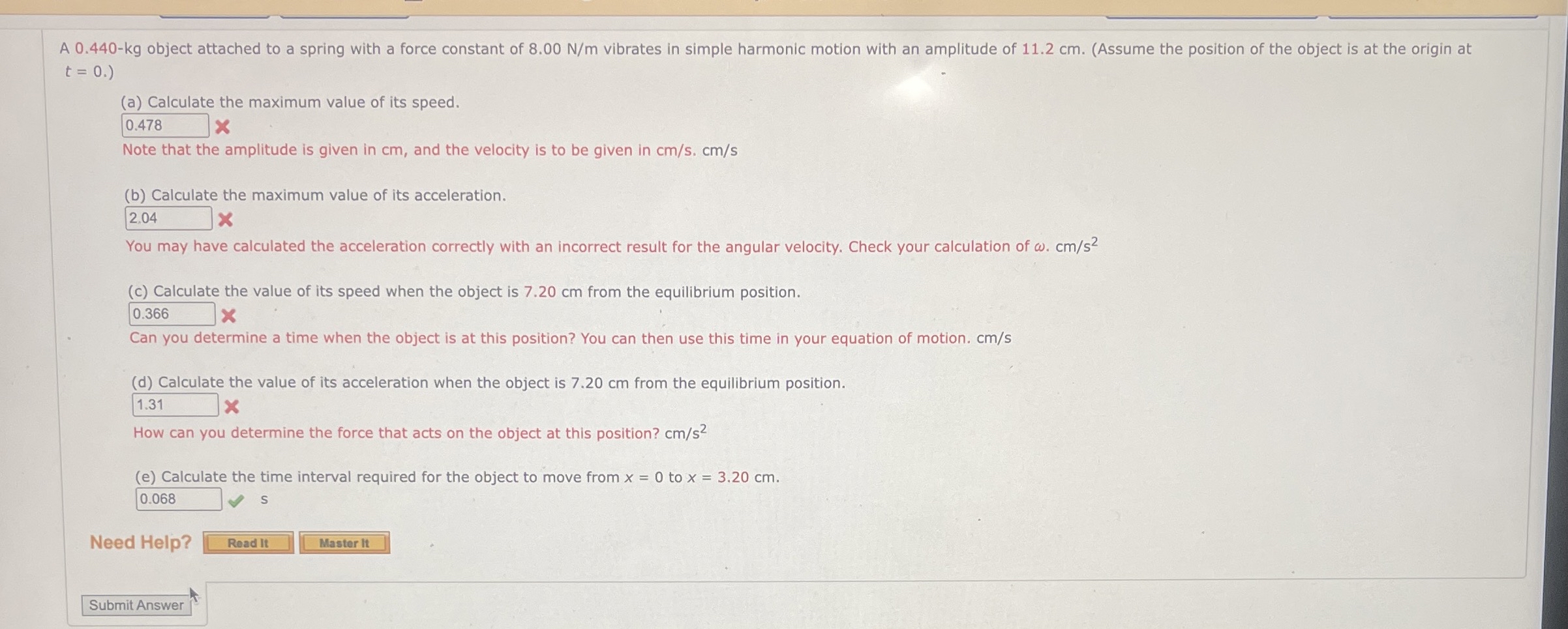 A 0 . 4 4 0 - k g object attached to a spring