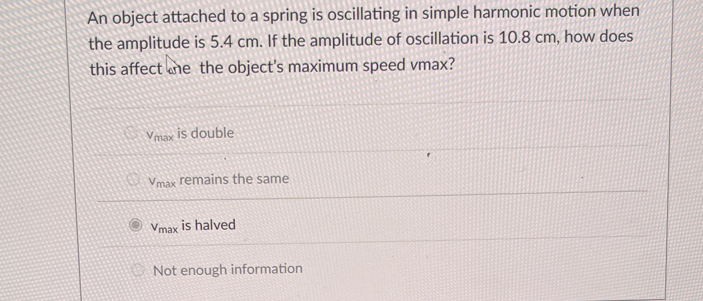 An object attached to a spring is oscillating in