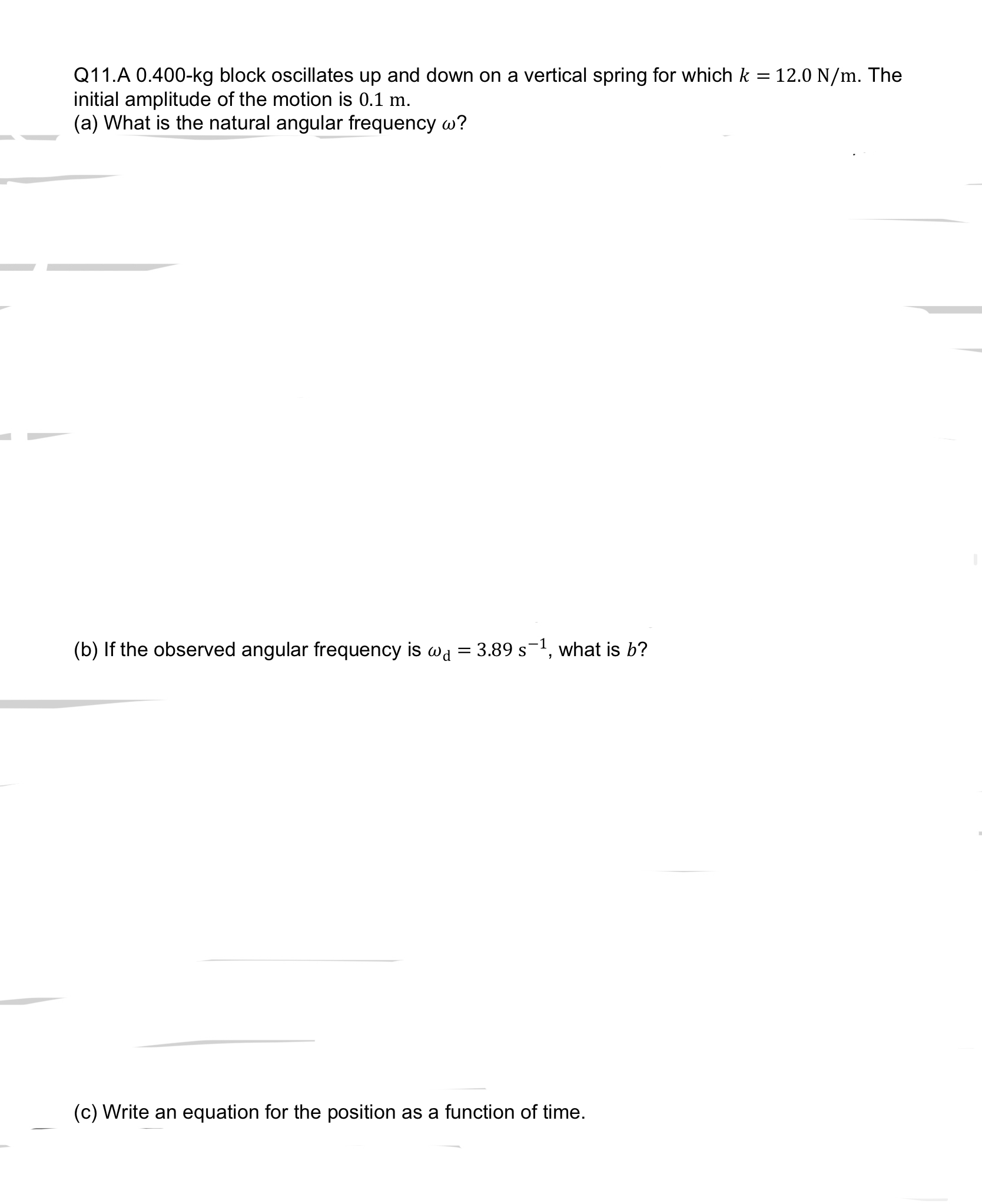 Q 1 1 . A 0 . 4 0 0 - k g block oscillates up and