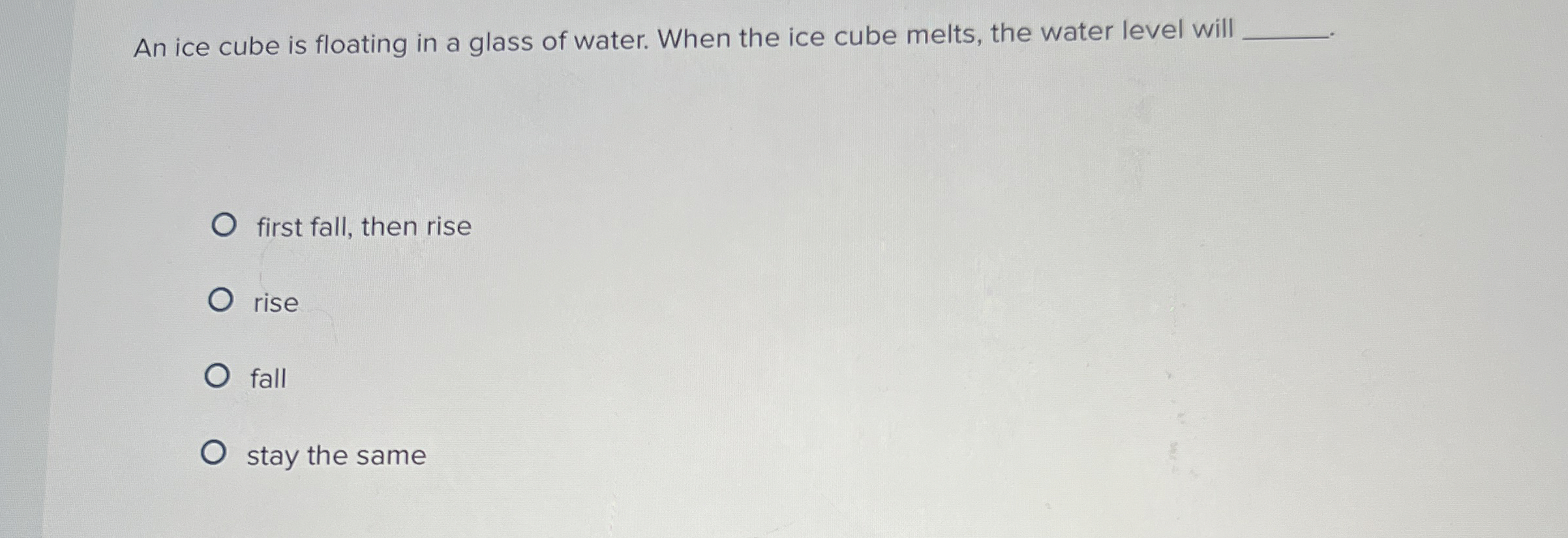An ice cube is floating in a glass of water. When