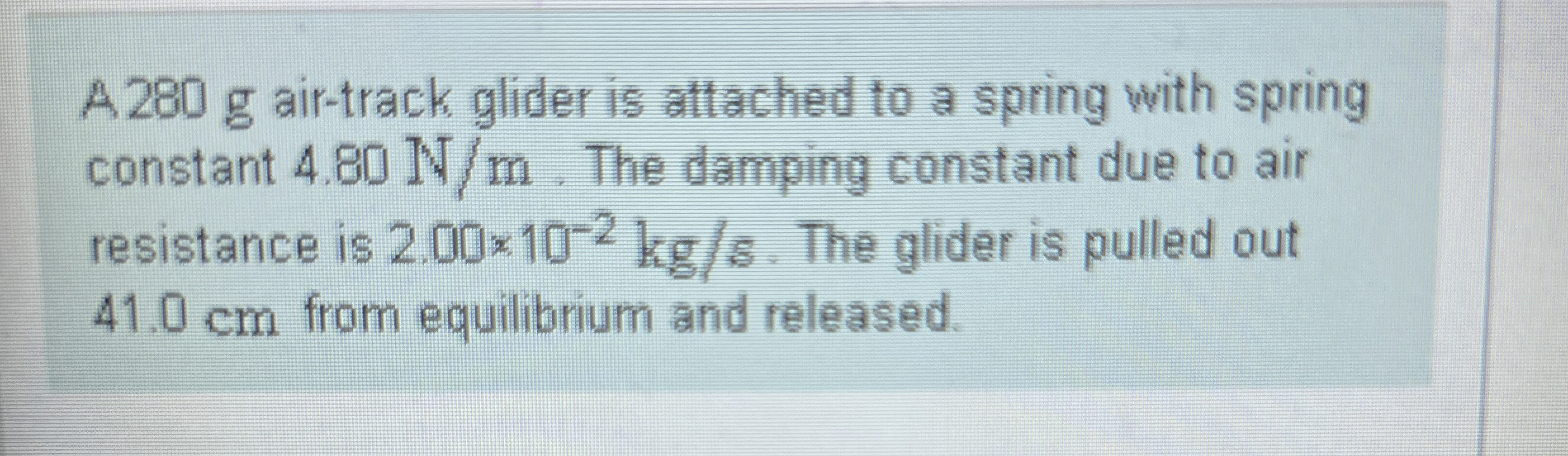 A 2 8 0 g air - track glider is attached to a