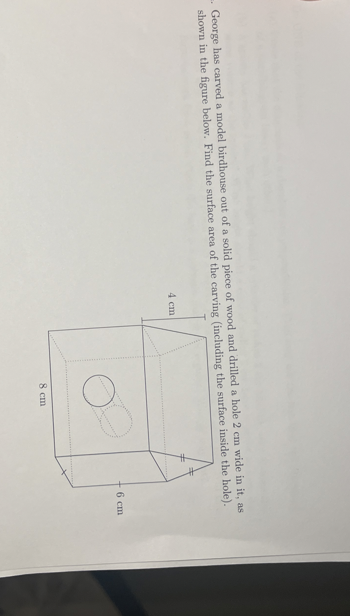 George has carved a model birdhouse out of a