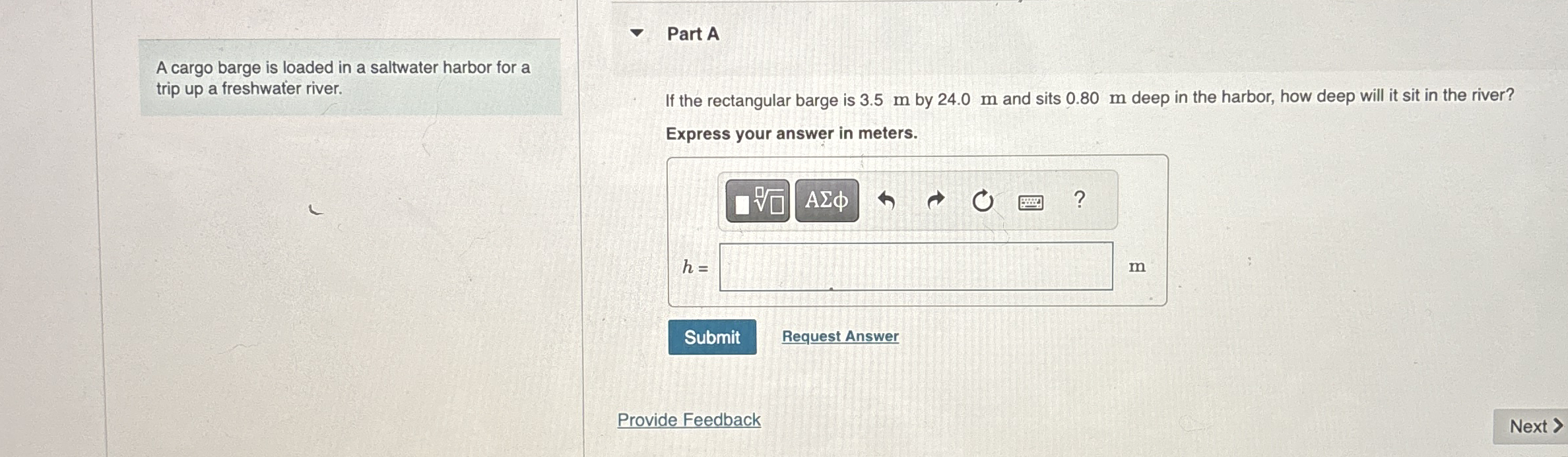 A cargo barge is loaded in a saltwater harbor for