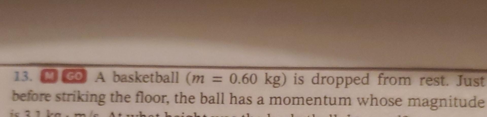 A basketball ( m = 0 . 6 0 k g ) is dropped from