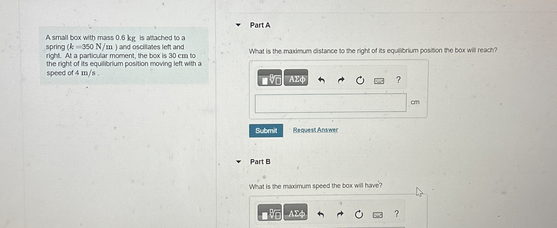 A small box with mass 0 . 6 kg is attached to a