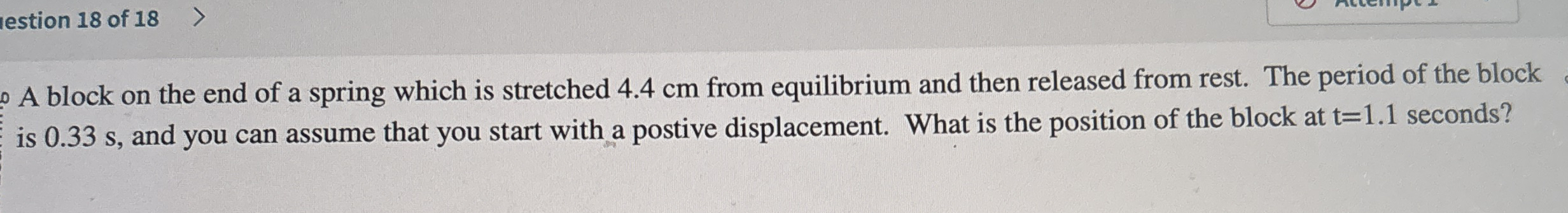 A block on the end of a spring which is stretched