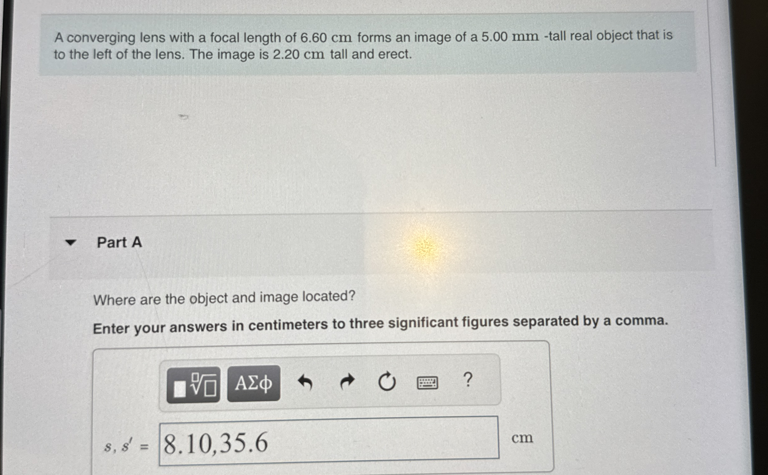 A converging lens with a focal length of 6 . 6 0