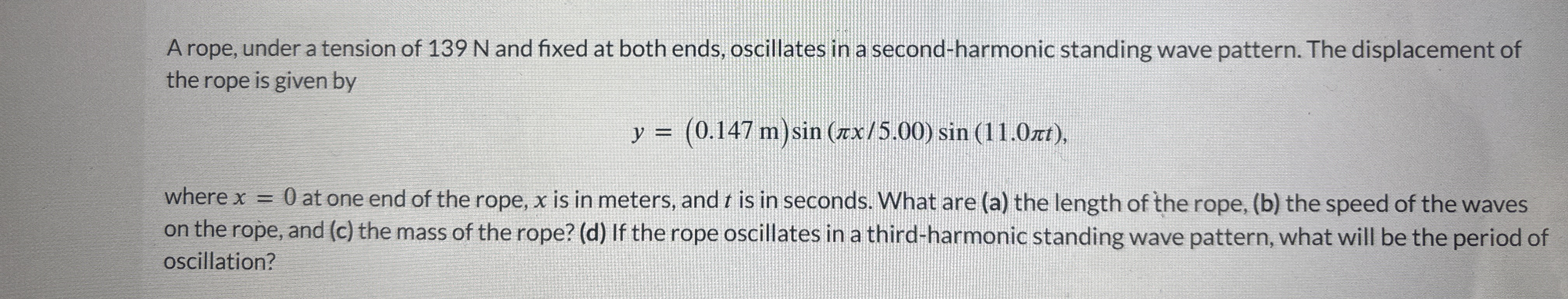 A rope, under a tension of 1 3 9 N and fixed at