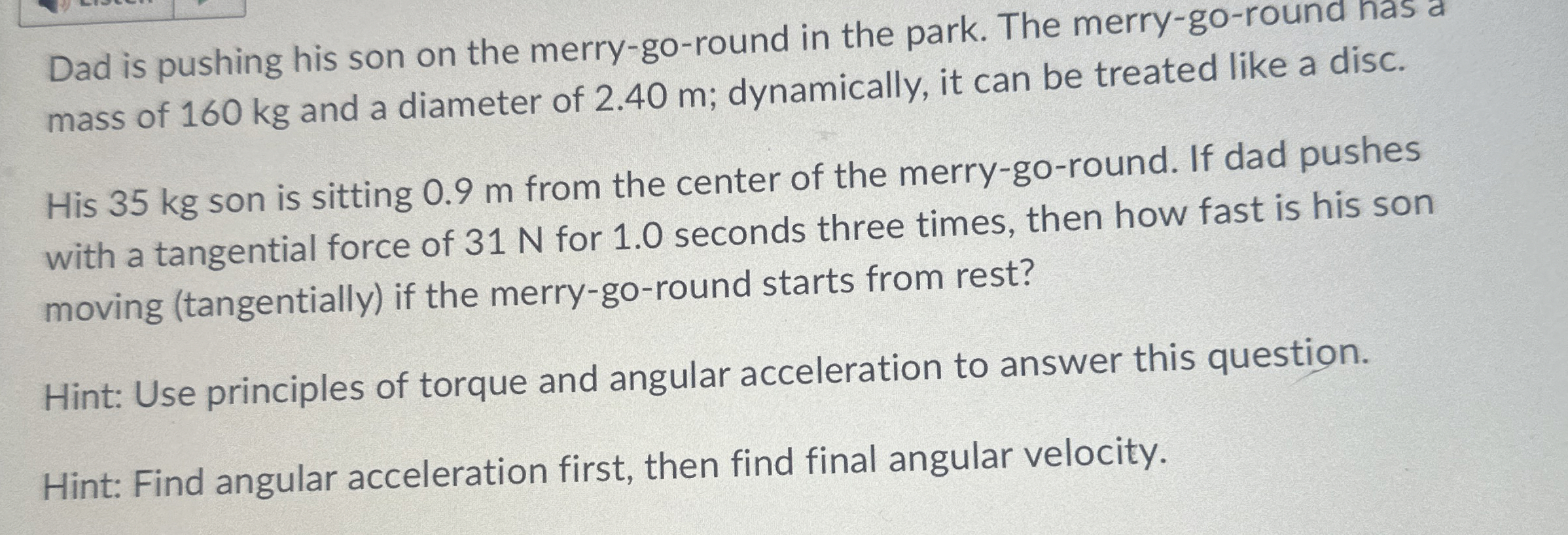 Dad is pushing his son on the merry - go - round