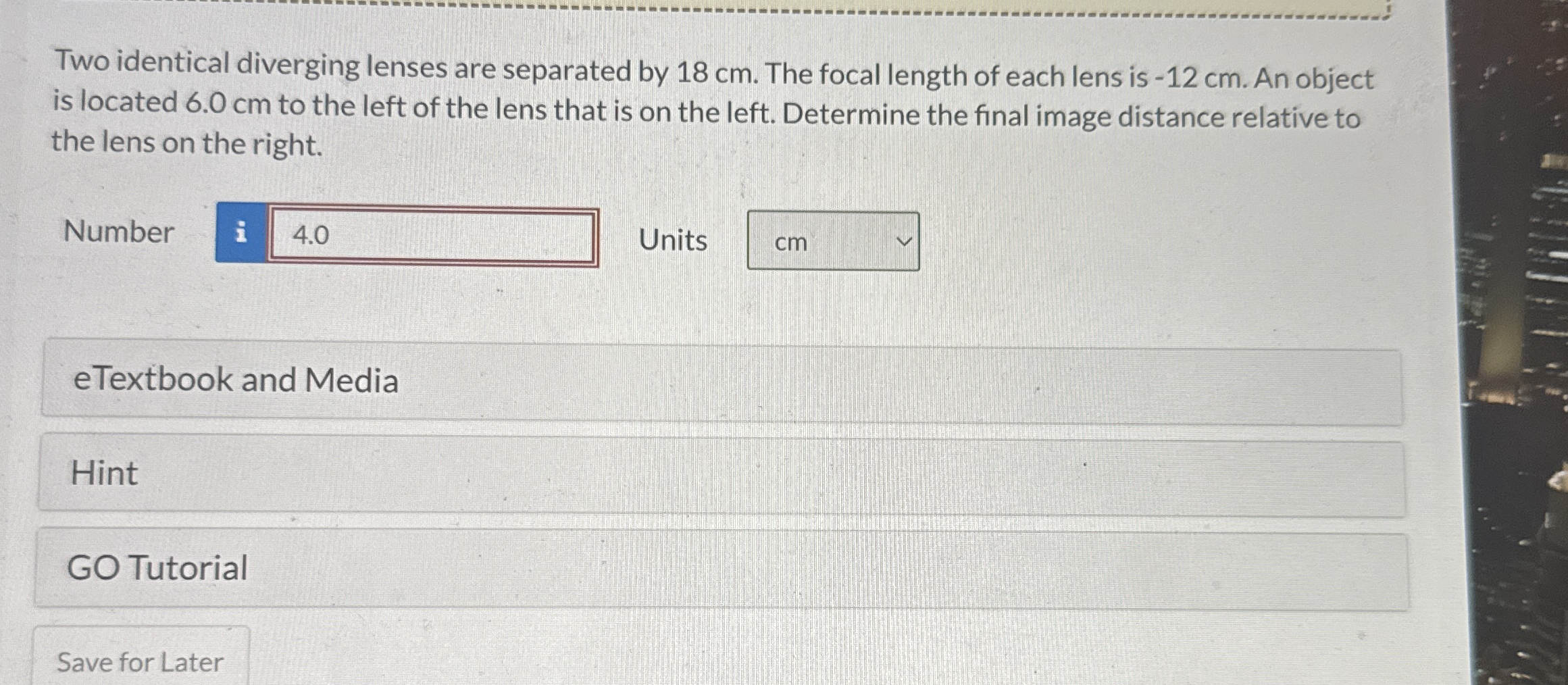 Two identical diverging lenses are separated by 1
