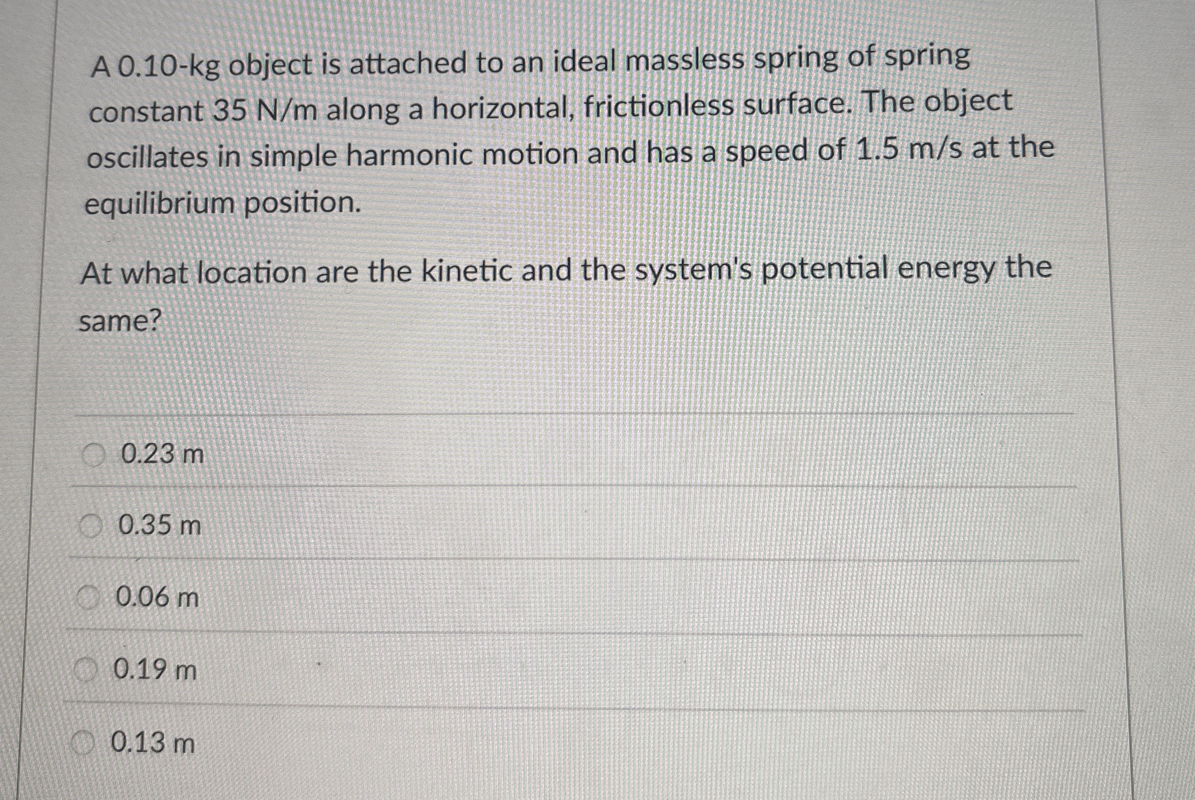 A 0 . 1 0 - kg object is attached to an ideal