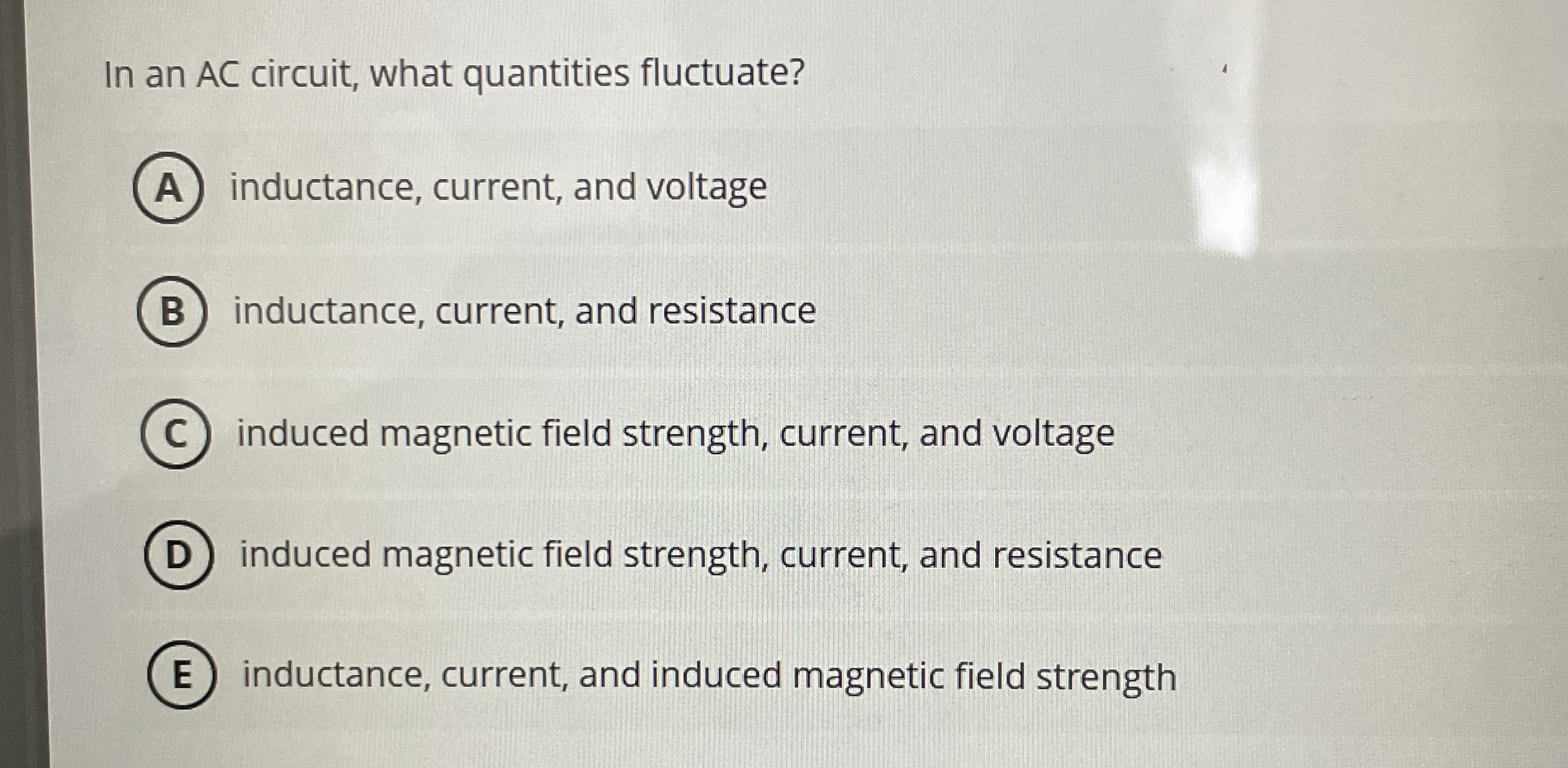 In an AC circuit, what quantities fluctuate?