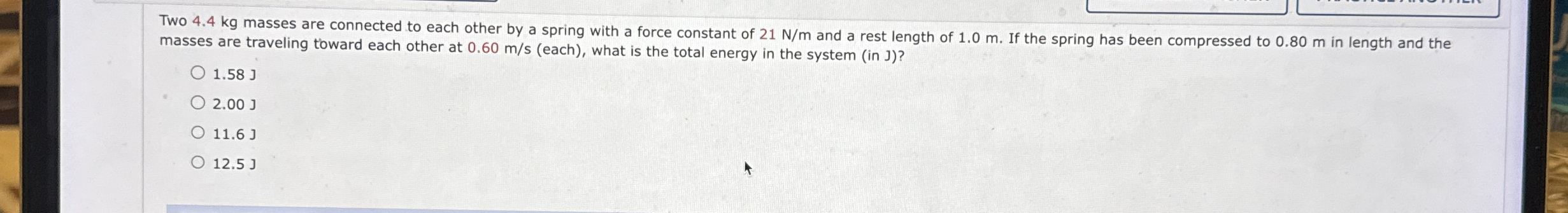 Two 4 . 4 kg masses are connected to each other