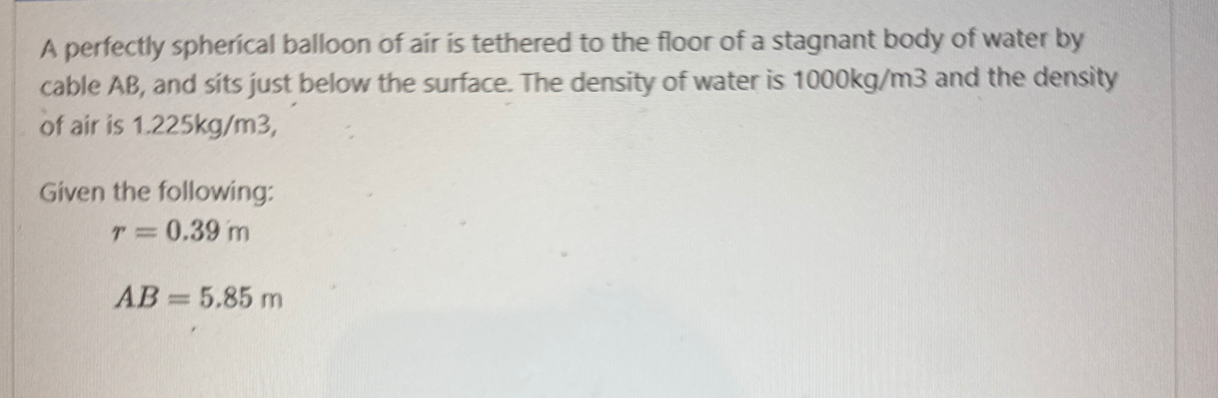 A perfectly spherical balloon of air is tethered