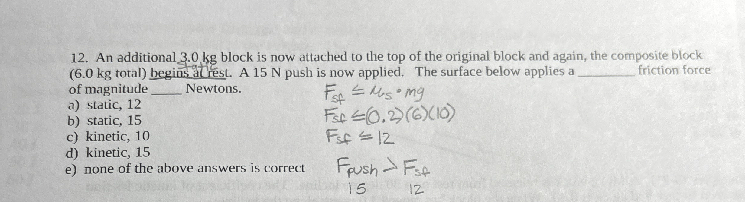 An additional 3 . 0 kg block is now attached to