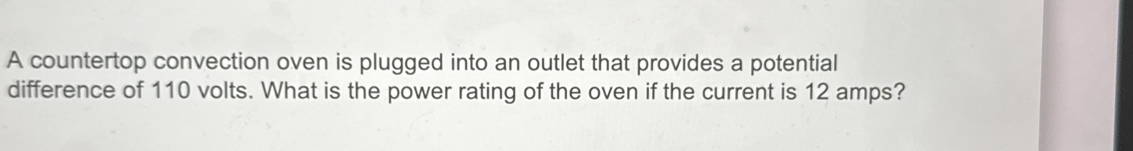 A countertop convection oven is plugged into an