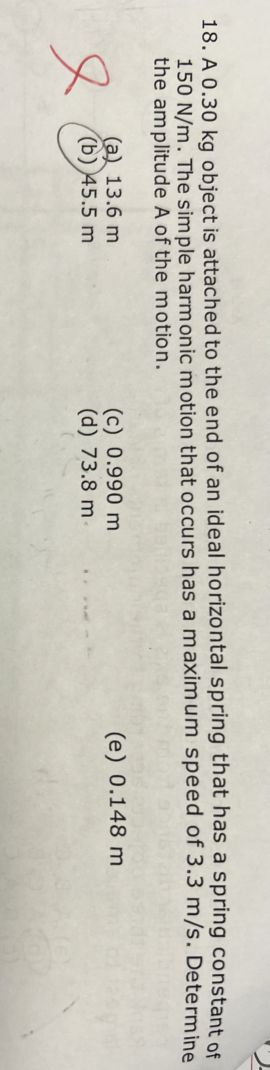 A 0 . 3 0 kg object is attached to the end of an