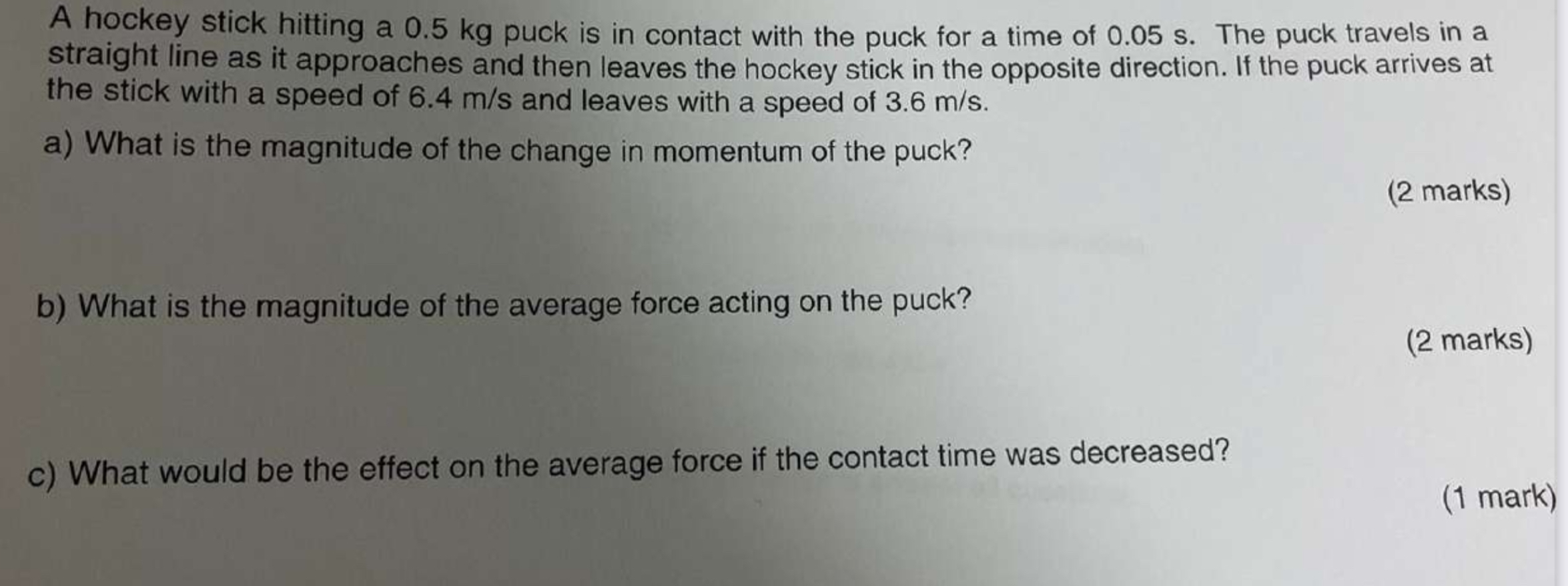 A hockey stick hitting a 0 . 5 kg puck is in