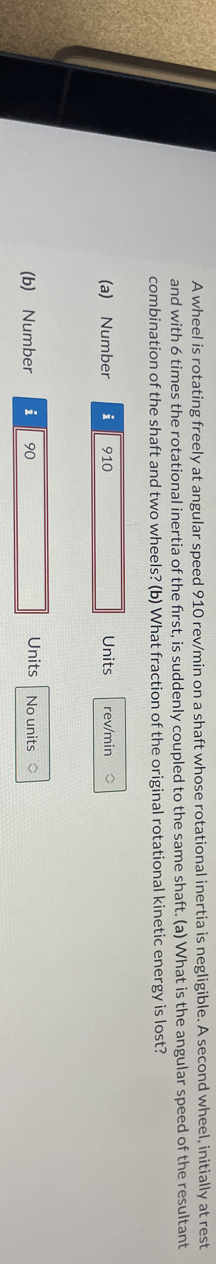 A wheel is rotating freely at angular speed 9 1 0