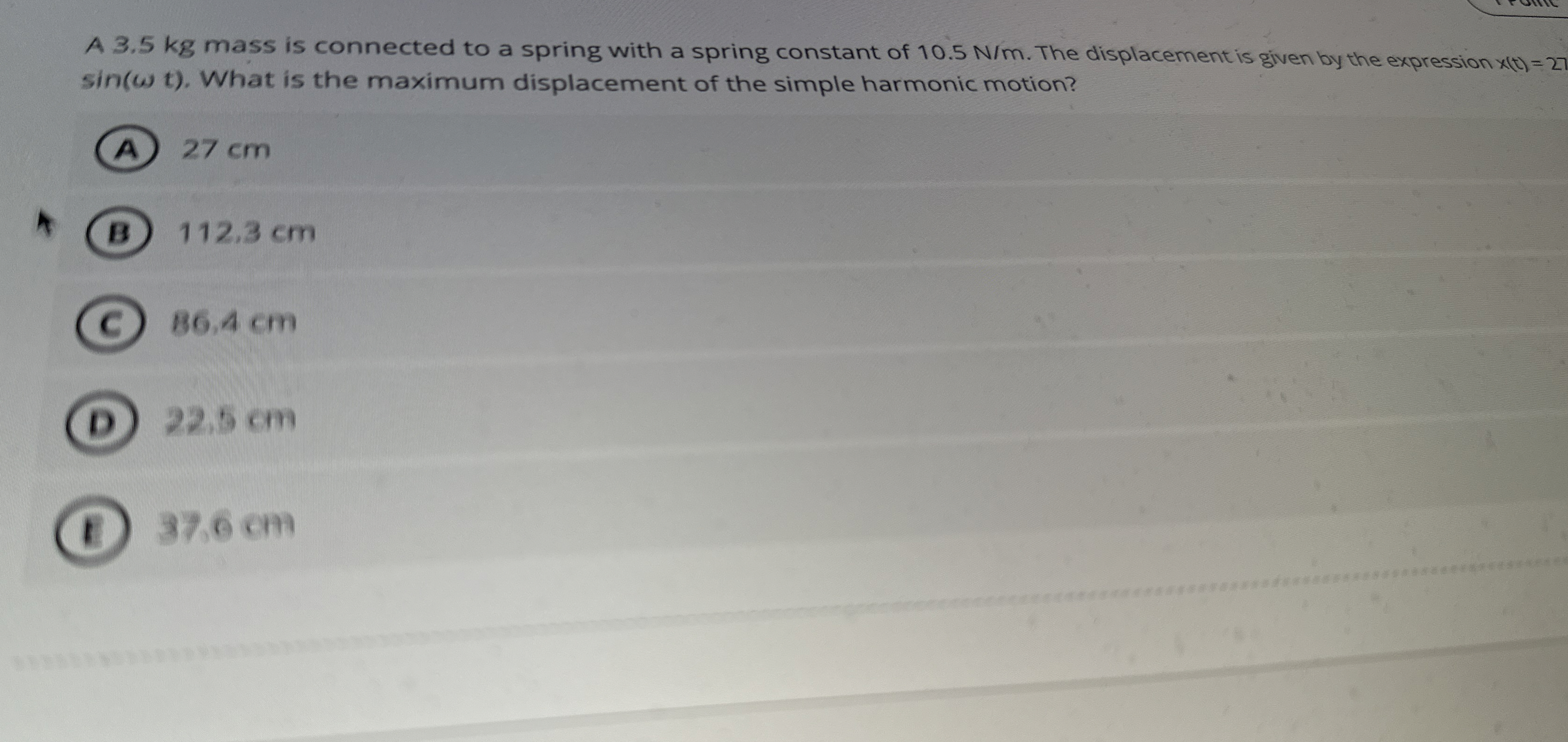 A 3 . 5 kg mass is connected to a spring with a