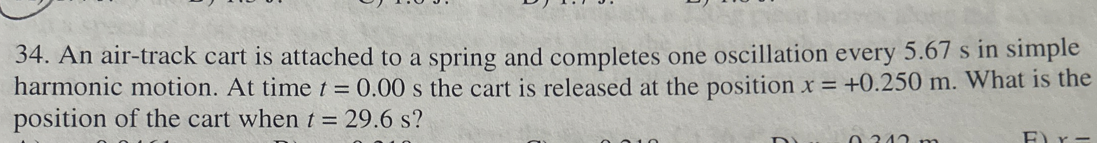 An air - track cart is attached to a spring and