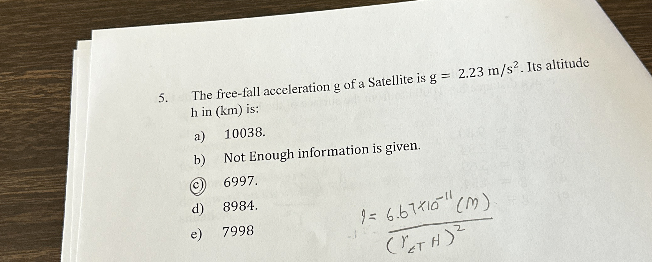 The free - fall acceleration g of a Satellite is
