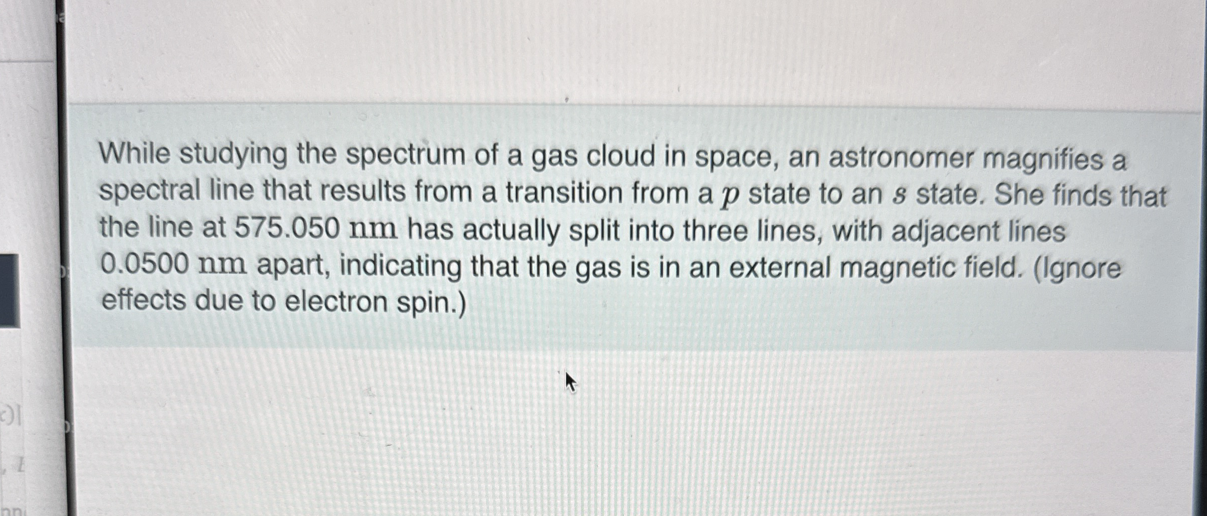While studying the spectrum of a gas cloud in