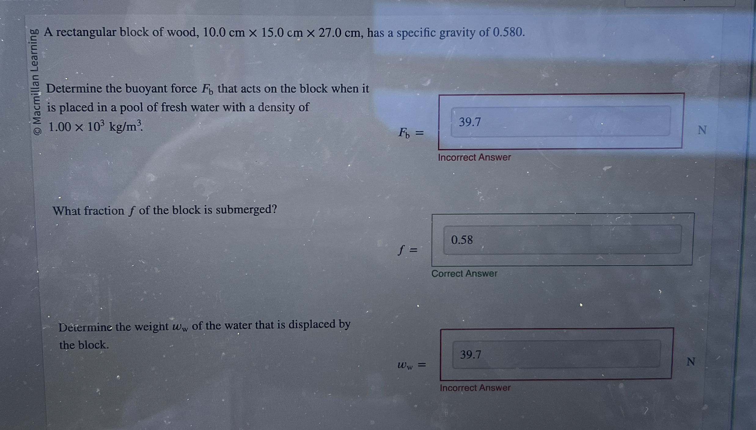 A rectangular block of wood, 1 0 . 0 c m 1 5 . 0