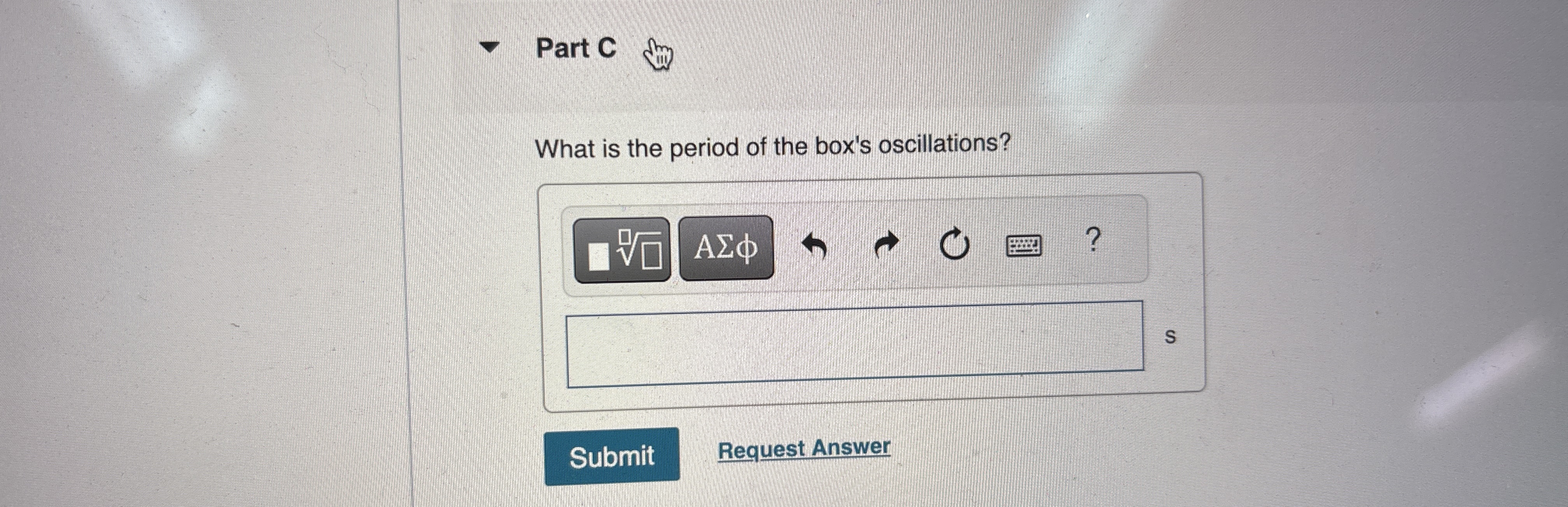 A small box with mass 0 . 5 kg is attached to a